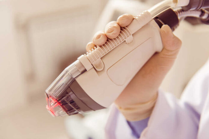 Doctor,Is,Holding,A,Modern,Medical,Equipment,For,Face,Skin