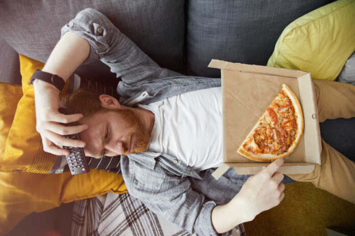 Above,View,Portrait,Of,Bearded,Man,Lying,On,Couch,And