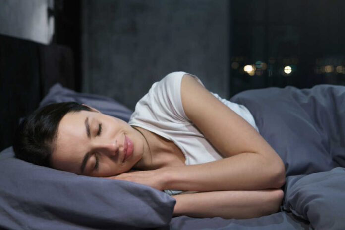 Young,Female,Sleeping,Peacefully,In,Her,Bedroom,At,Night,,Relaxing