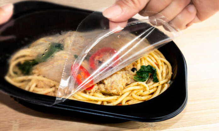 Food,Delivery,Service:,Woman,Hands,Holding,Open,Cling,Wrap,And